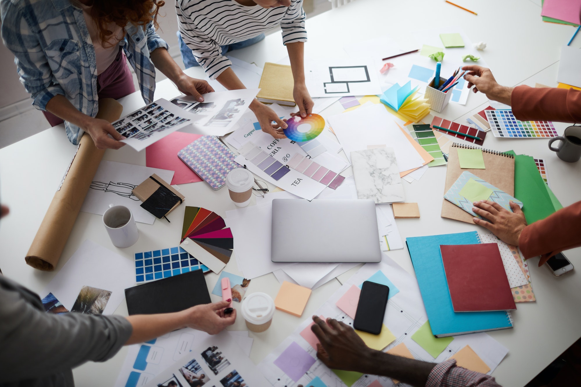 Creative Designer Team Discussing Production over Table